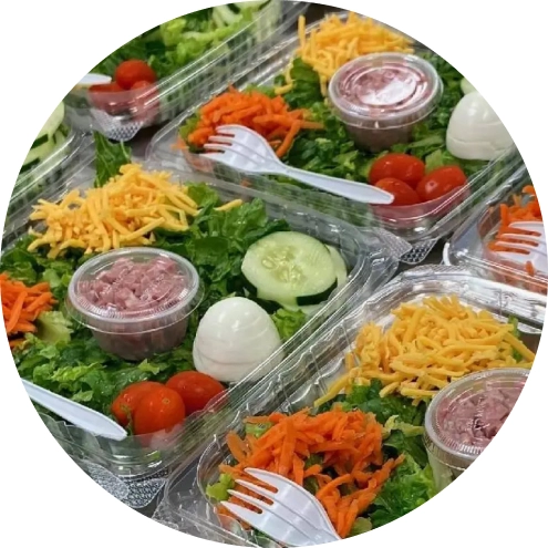 Image of multiple packaged salads.